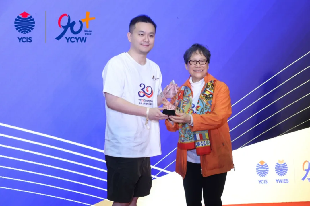 Mr David Chau (left) received the award on-site at YCIS Shanghai.