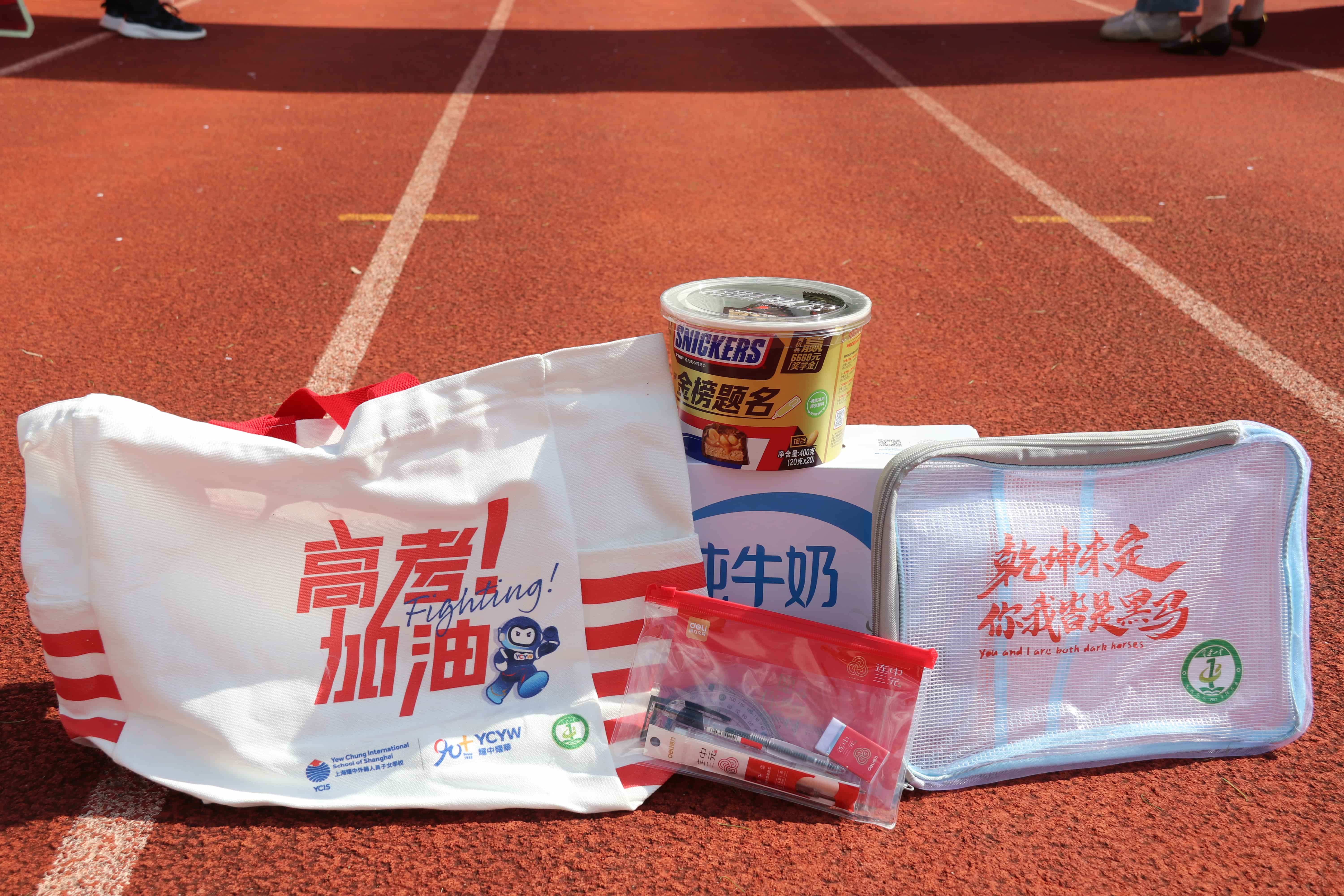 Gaokao Energy Pack contents: YCIS tote bag, Snickers, milk, and stationery