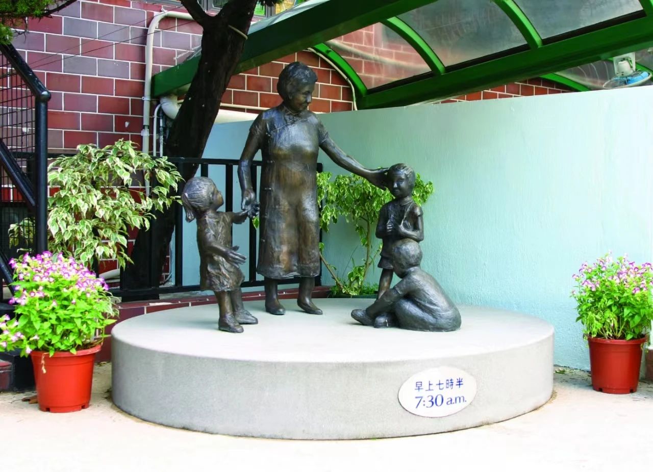  “7:30 a.m.”, the statue commemorating YCYW's founder, Madam Tsang Chor-hang 