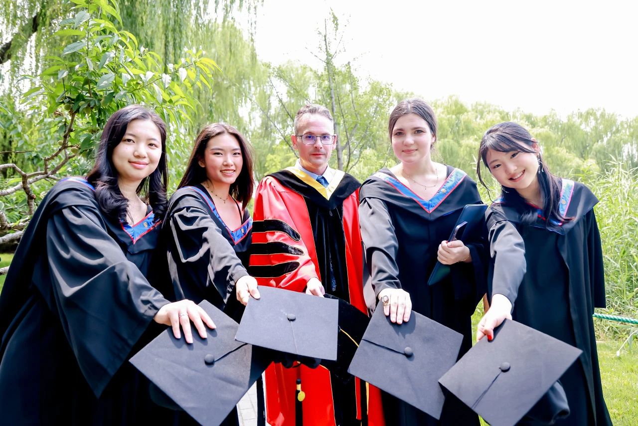 Graduation photo with teachers and classmates